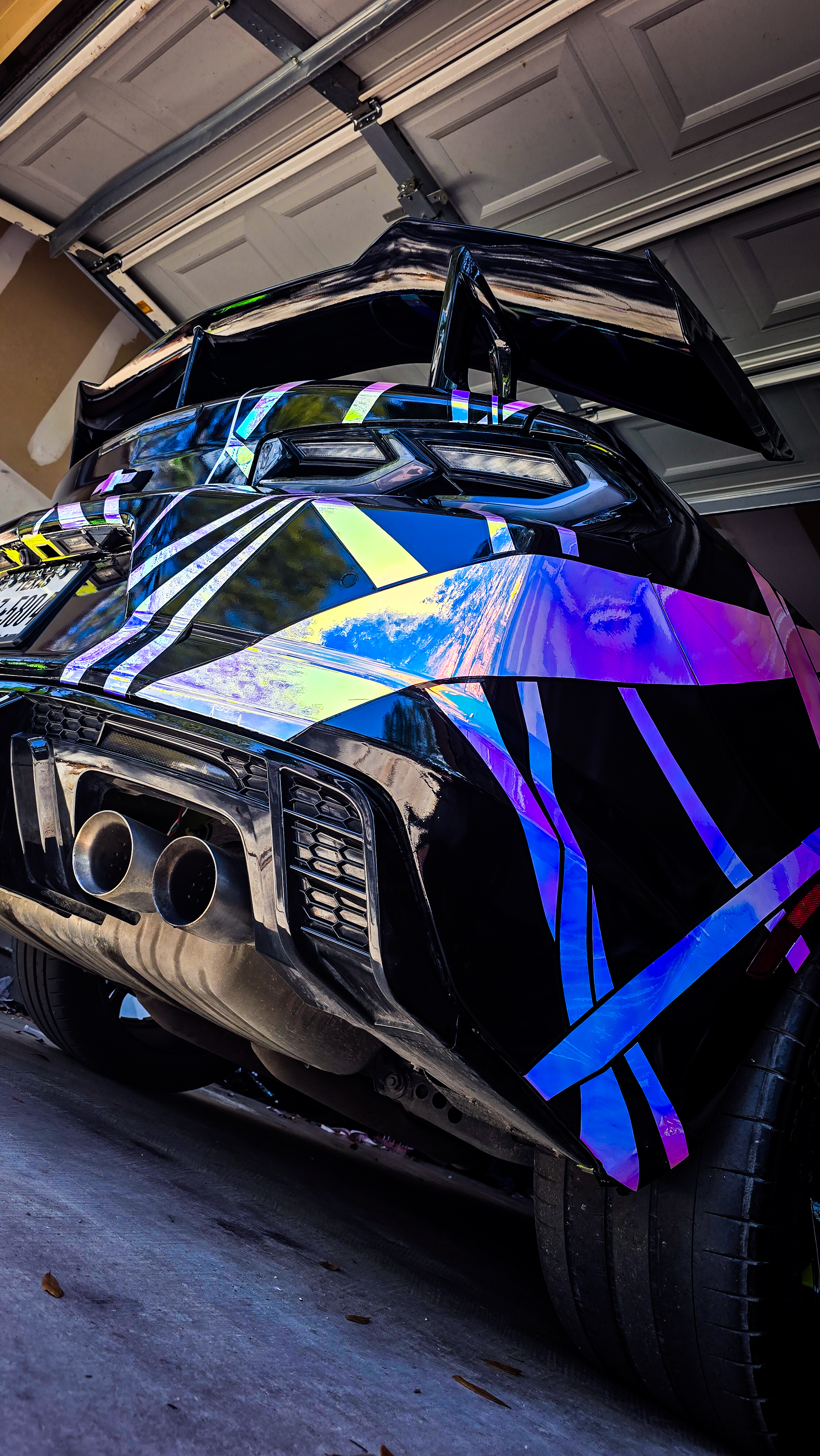 6th Gen Chevrolet Camaro SS wrapped with a custom neo chrome abstract vinyl design over gloss black.