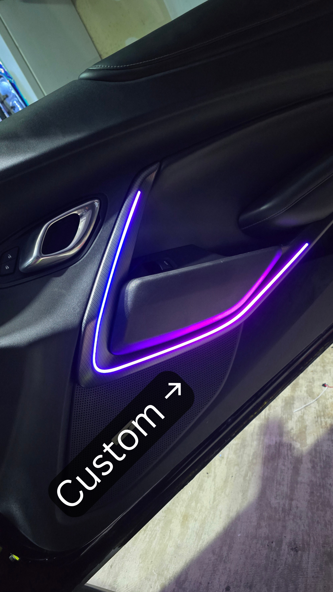 Extended custom RGB ambient lighting installed on a 6th Gen Camaro door panel.