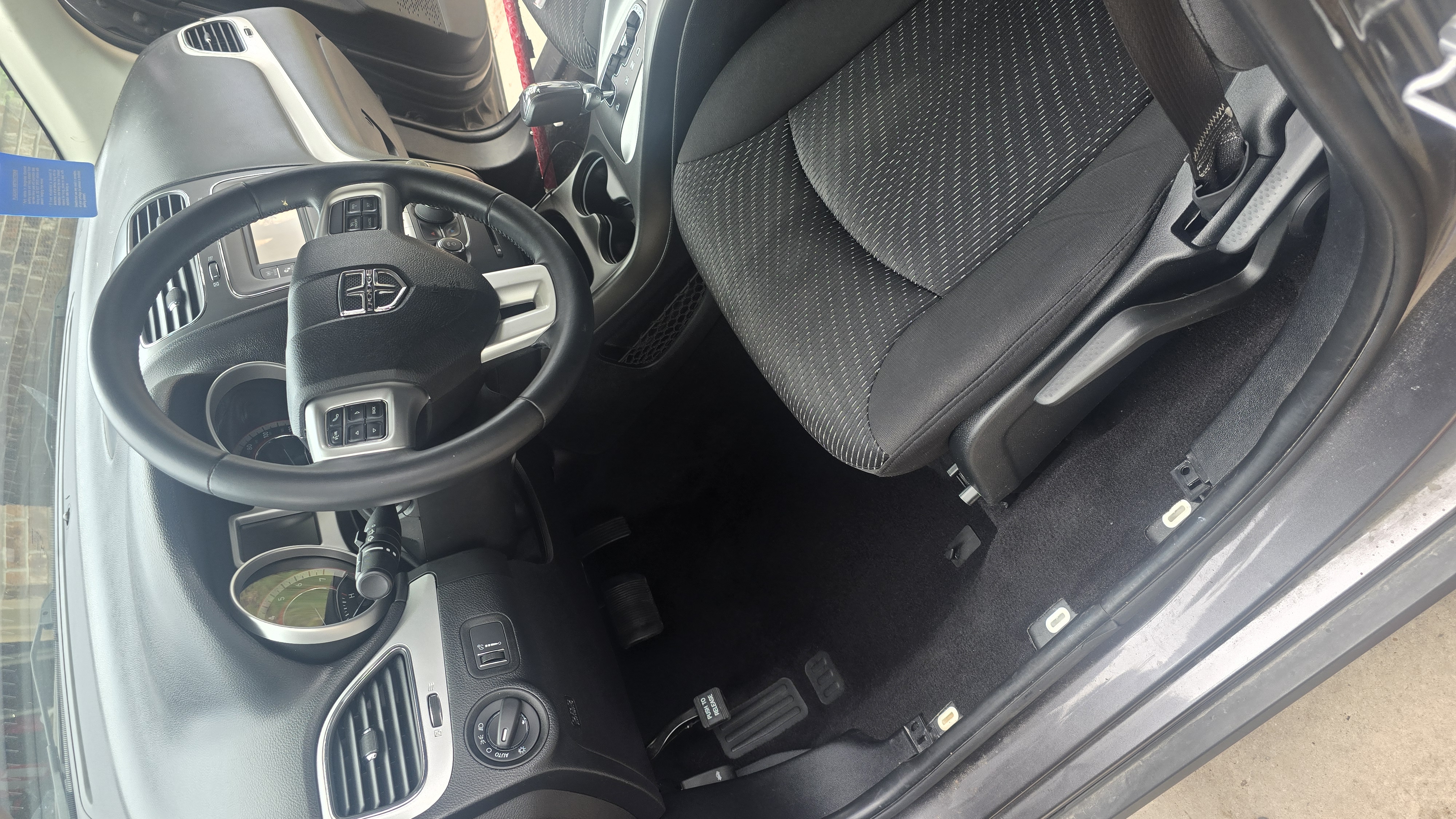 Driver's side interior of a Dodge Journey after a complete interior detailing service.